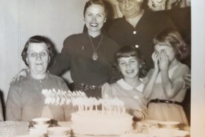 29My lost cousin VirginiaSuzanne JacksonOnondaga CountyThis is a photo of my mother, Georgene on her birthday. She is with her parents and my cousin Virginia and ge

Her sister. My great grandparents immigrated from Czechoslovakia at the Turn of the century
I just discovered Virginia's story this fall. My mother never spoke of her.
Virginia was my mother's younger first cousin, the child of her father's brother and his wife. Virginia looked up to my mom and lived around the block from her father's family. She stayed with them often.

Sadly, Virginia's parents died when she and her siblings were still young. Virginia and her sister were sent to live her mother's family and lost touch with our side completely. 
My mother passed away in 2001 and never saw Virginia again. Virginia 's granddaughter found me on "23 and Me". When we discovered our connection we were able to puzzle out the relationship between Virginia and I. Her granddaughterarranged for Virginia and I to speak on the phone. Before she reached out I did not know Virginia existed.
I hope I can meet her some day and hear more of the stories she has to tell about her life and relationships with I my family.