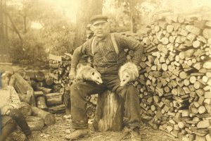 33Lambert A. WellerNancy BecerraOnondaga CountyThis is my great-great grandfather, Lambert Weller (1852–1935). Lambert was born in Clay, NY, where he married Mary Sellens in 1876. He began digging the cellar for his new store in September 1897, near the Cigarville (Clay) train station. The building, known locally as Weller Hall, served as a grocery store, post office, dance hall, and meeting space. This photo of Lambert with the opossums is a family favorite. That twinkle in his eye makes us long to hear all the stories he could share.