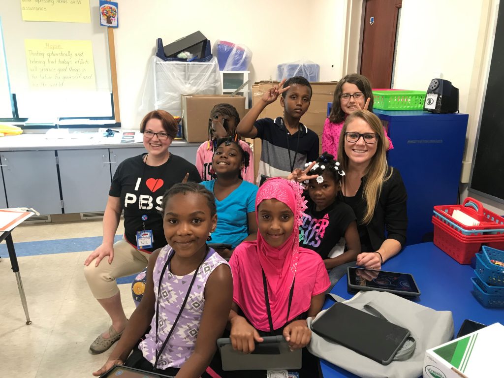 (group photo from left: Miss Kyla, Blessed, Taylor, Kabul, Abdigami, Destiny, Riley, and Mrs. Caroline)