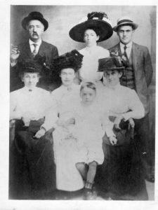 23John Jacob Franzen & FamilyKaren Fauls-TraynorOnondaga CountyThis is our 3rd great-grandfather, John Jacob Franzen and his family. He emigrated to the Syracuse in the 1850's with his parents, in part to avoid the mandatory military conscription required in Germany at that time, only to enlist for the US Civil War at the age of 17. He served in Company B of the 185th Infantry under Captain John Listman and Colonel Edwin Jenney. After the war, he would dress up in his uniform for parades and go visit the schools to tell them stories of the war. He worked for the Bendixen-Peck Cigar Company and was a member of the Cigar Makers Union. He is pictured here in 1907 with his wife and family members. From left to right, top row: John Jacob Franzen (with the cigar), his daughter Jessie Franzen, his son-in-law Humphrey Bush. Bottom row: His wife, Elizabeth (Libby) Smith Franzen, his daughter Julia Franzen Bush holding her son Donald and daughter Mary Elizabeth (Tibby) Franzen, who was our great-grandmother.